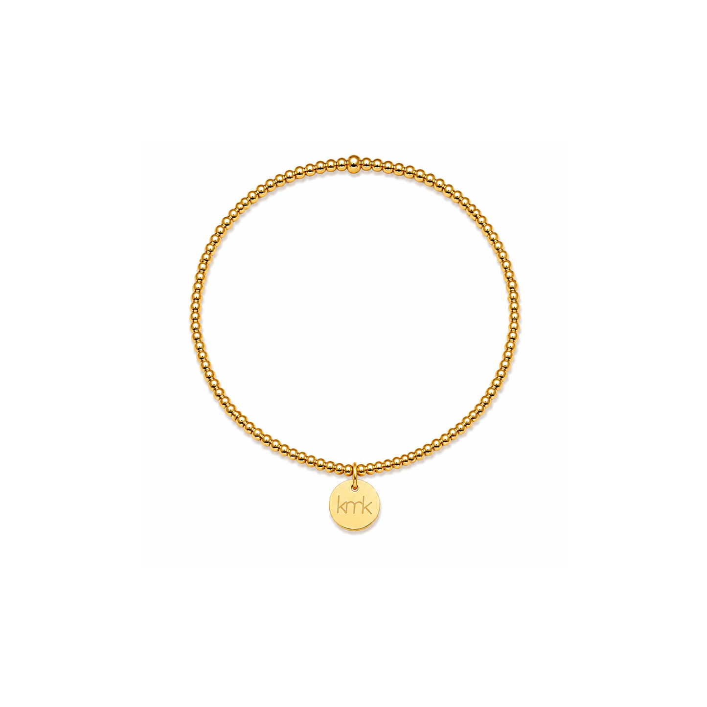 A delicate gold chain bracelet with a small round gold disc charm engraved with the initials 'KMK', displayed on a clean white background.