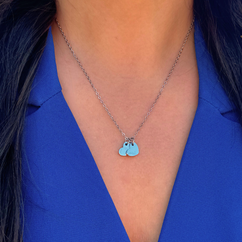 Silver necklace featuring two heart charms