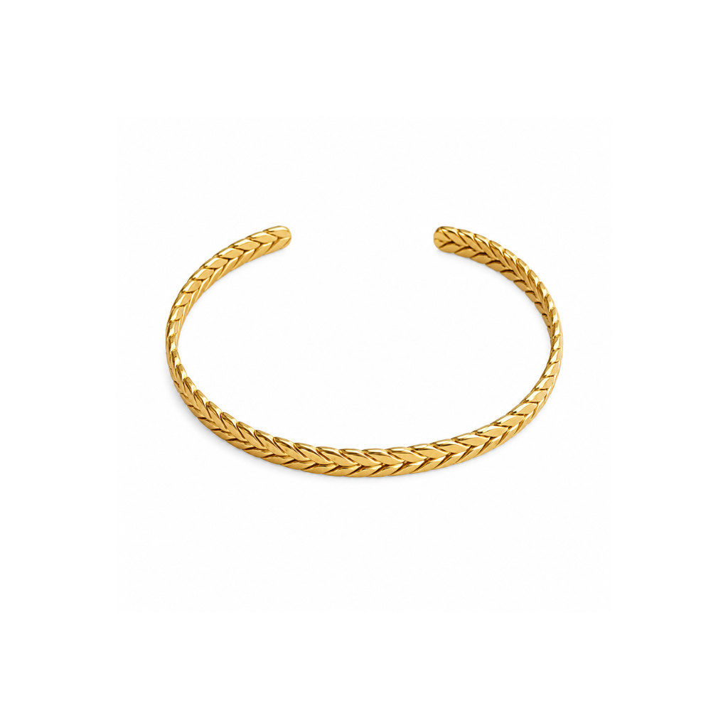 A gold braided cuff bracelet with an open end, displayed on a clean white background.