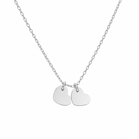 Silver necklace featuring two heart charms