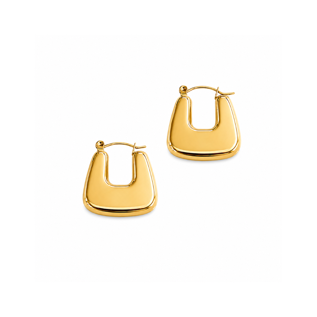 A pair of polished yellow gold hoop earrings with a modern, slightly curved rectangular shape, displayed on a clean white background.