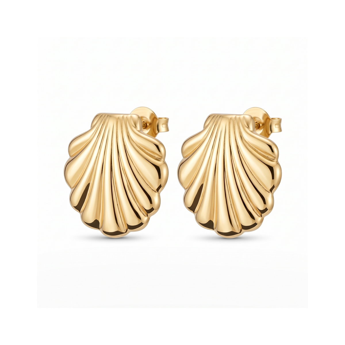 A pair of gold shell-shaped stud earrings with a ribbed, scallop-like texture, shown on a clean white background.