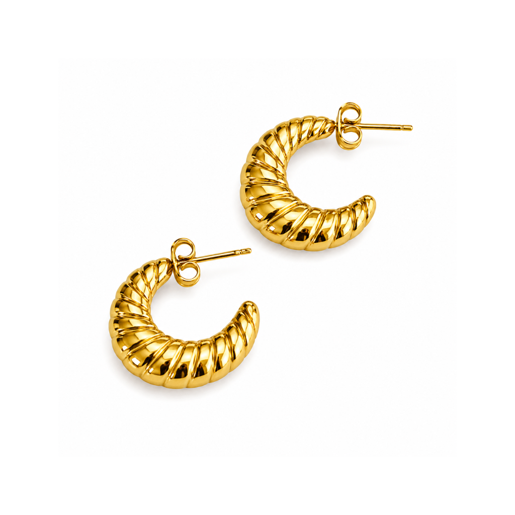 Gold hoop earrings on a white background