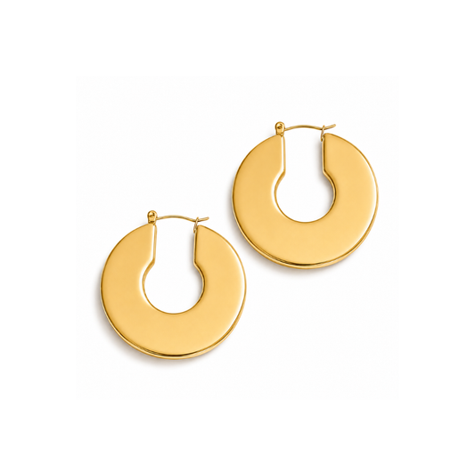 A pair of gold-toned hoop earrings with a thick, open circular design, displayed on a clean white background.