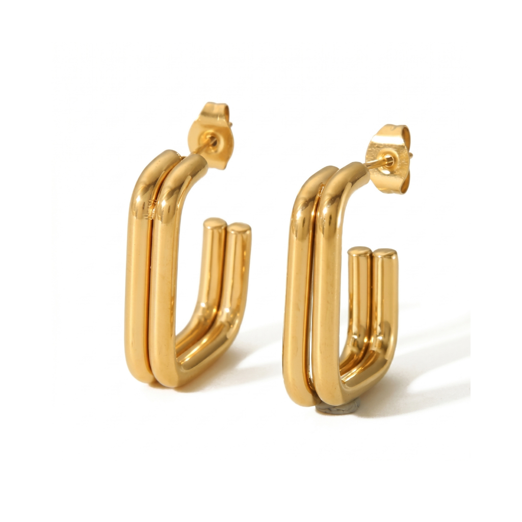 Gold hoop earrings on a white background