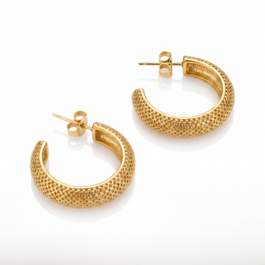 A pair of textured gold hoop earrings with post-back closures, displayed on a clean white background.