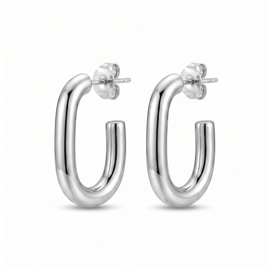 A pair of polished silver hoop earrings with a thick, rounded tubular design and butterfly backings, shown on a clean white background.