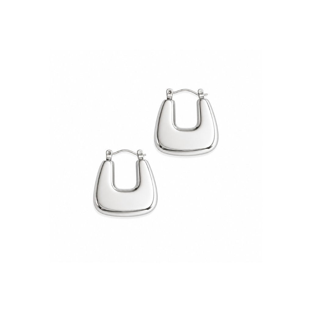 Silver u-shaped earrings on a white background