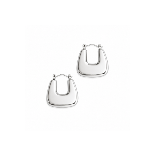 Silver u-shaped earrings on a white background