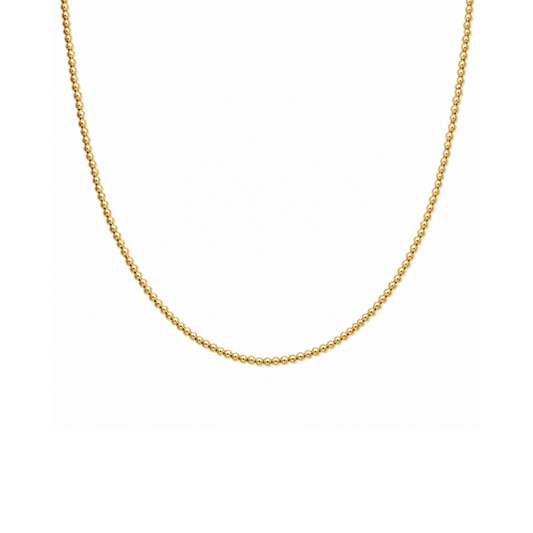 A delicate gold beaded chain necklace displayed against a solid white background.
