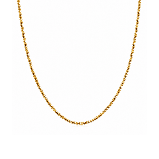 A delicate gold beaded chain necklace, shown draped in a U-shape against a solid white background.