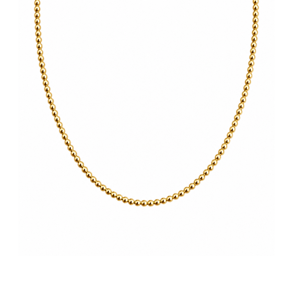 A delicate gold beaded chain necklace, shown in a U-shape against a solid white background.