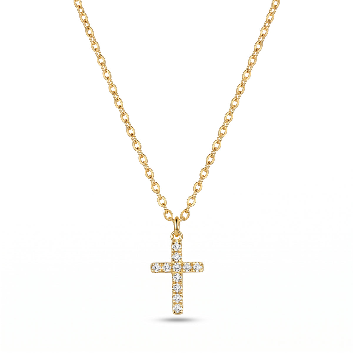 Gold cross necklace with diamonds on a white background