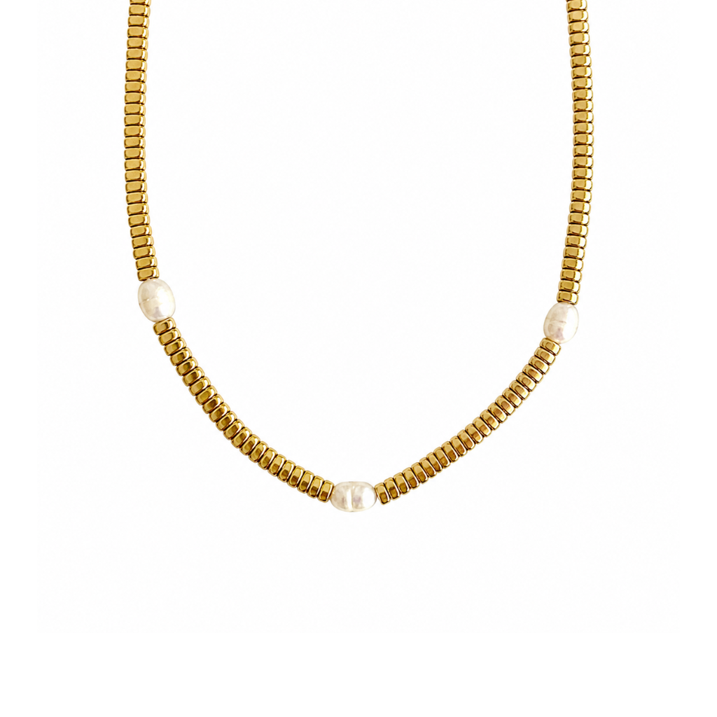 A gold beaded chain necklace with three small, round white pearl-like beads spaced along the front, displayed against a solid white background.