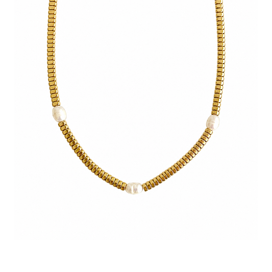 A gold beaded chain necklace with three small, round white pearl-like beads spaced along the front, displayed against a solid white background.