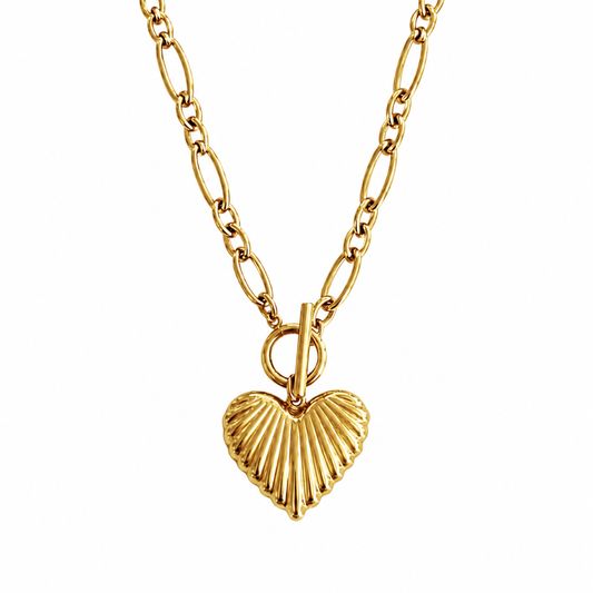 A gold chain necklace featuring a textured, ribbed heart-shaped pendant, displayed against a solid white background.