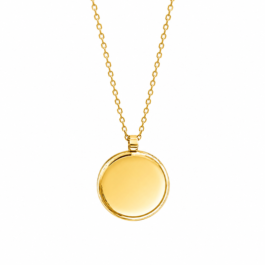 A gold chain necklace with a round, polished gold pendant, shown against a plain white background.