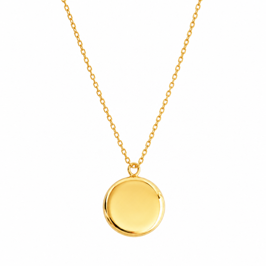 A polished yellow gold disc pendant necklace on a delicate gold chain, shown against a plain white background.