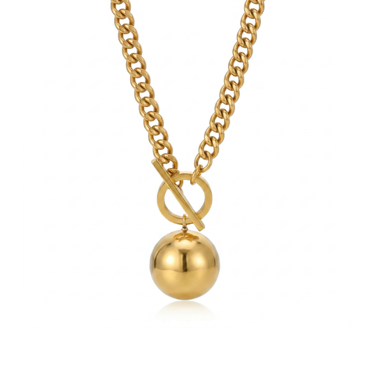Gold necklace with a round pendant on a white background