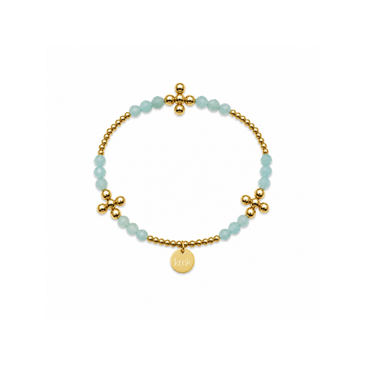 A delicate gold beaded bracelet with light blue faceted beads, gold flower-shaped charms, and a small round gold disc charm engraved with 'LULU', displayed on a clean white background.