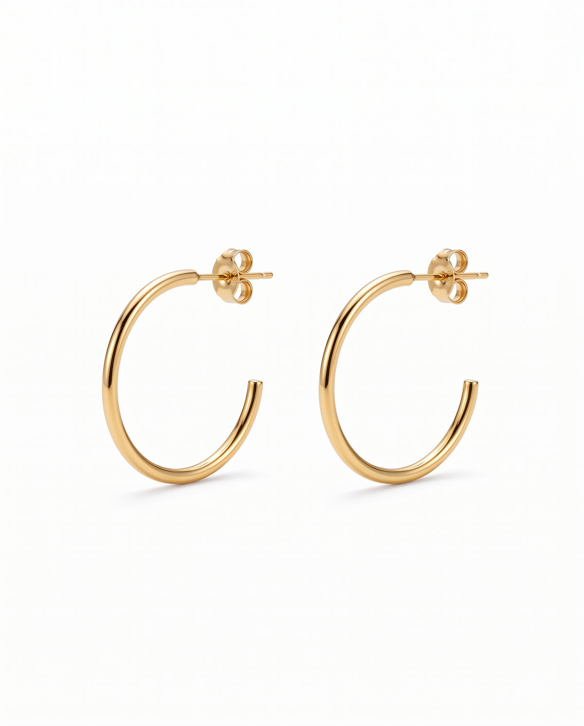 A pair of gold open hoop earrings with flat backings, displayed on a clean white background.